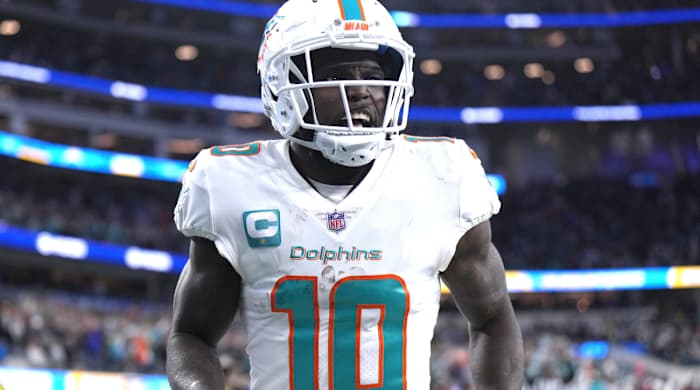 Dec 11, 2022; Inglewood, California, USA; Miami Dolphins wide receiver Tyreek Hill (10) celebrates after scoring on a 60-yard touchdown reception in the second half against the Los Angeles Chargers at SoFi Stadium. Mandatory Credit: Kirby Lee-USA TODAY Sports